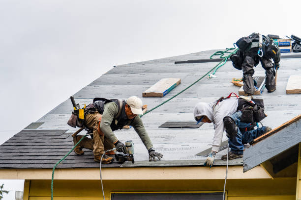 Professional Gutter Installation technician working in Winchester, MA